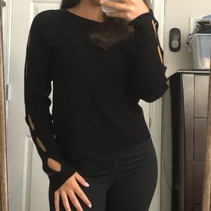 Woman’s sweater with circle detail on arms